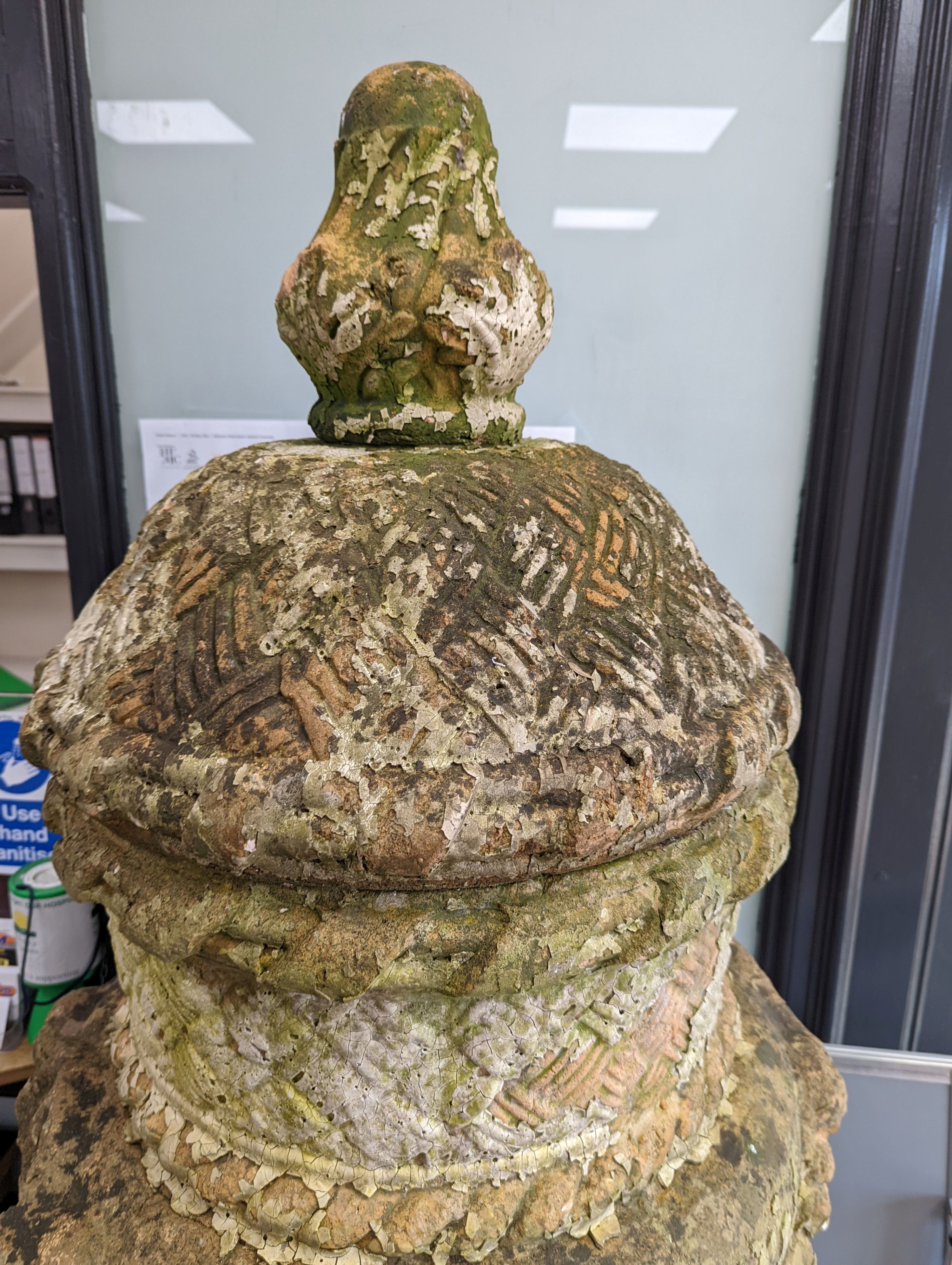 A large weathered Victorian painted terracotta lidded urn on plinth base, diameter 64cm, height 200cm